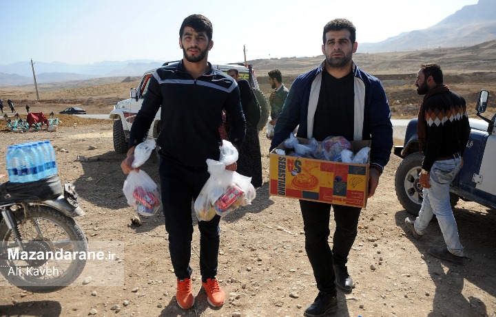 حرکت خداپسندانه قهرمانان کشتی جهان و المپیک ایران در کرمانشاه+ عکس